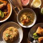 High-protein vegan Indian breakfast spread with tofu bhurji, moong dal chilla, quinoa poha, and smoothie