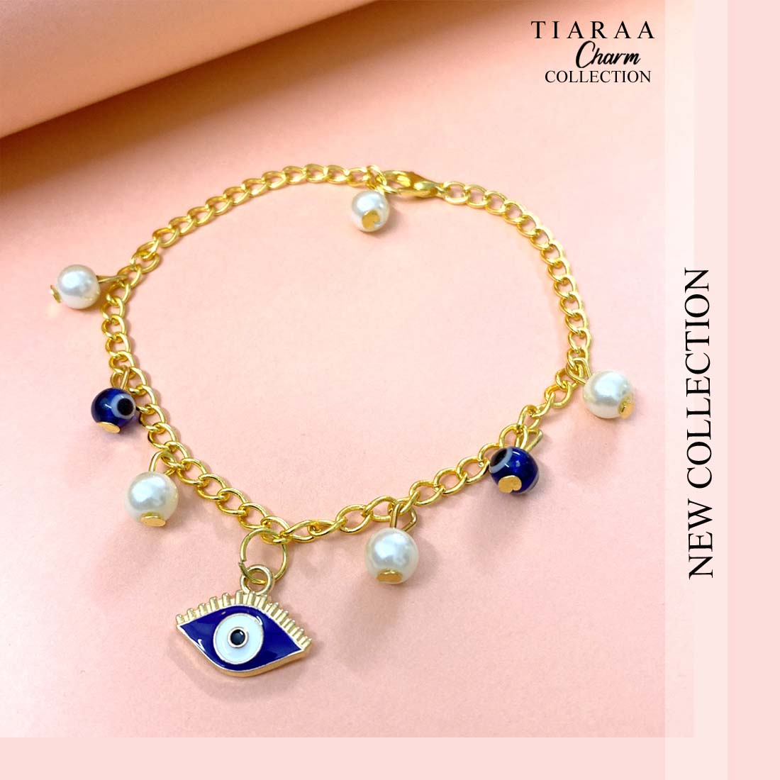 TCB367copy.jpg Blue Evil Eye Pearl Golden Charm Bracelet - Image 1